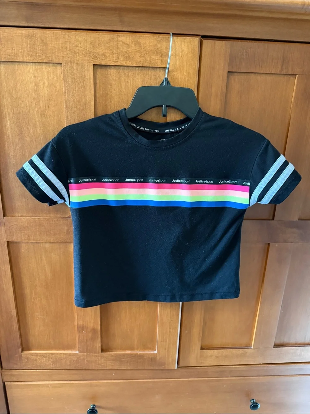 Justice black tee with rainbow stripe